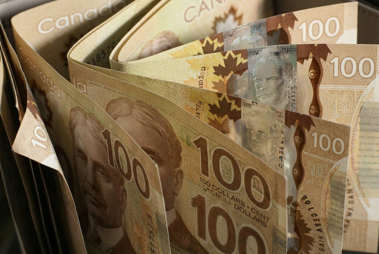 Fanned stack of Canadian one-hundred-dollar banknotes